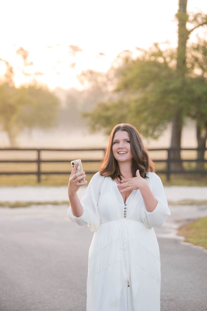 female entrepreneur business coach taylor lee walking and talking on her phone for voxer and telegram support for her clients