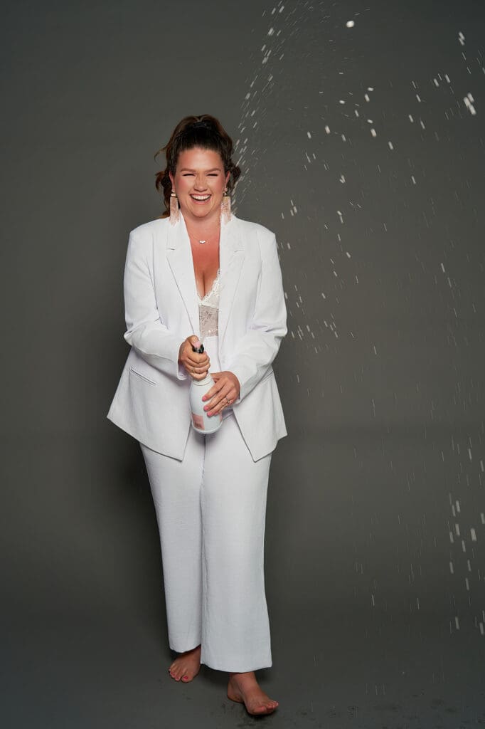 photos that build authority for coaches celebrating with champagne